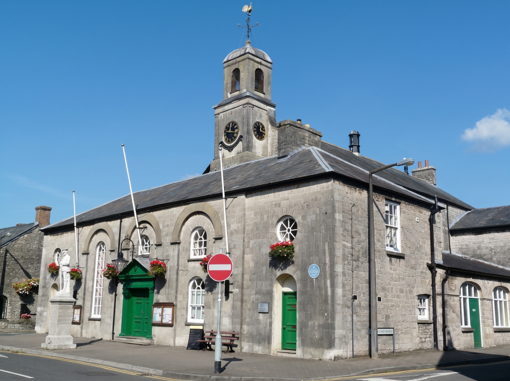 Cowbridge Town Hall with its clock tower and flower baskets