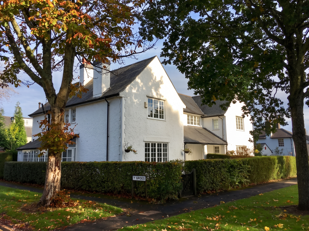 White detached house under autumn trees in Rhiwbina, Cardiff